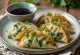 Spinach Gyoza, сервирана с плънка от спанак и дип от соев сос